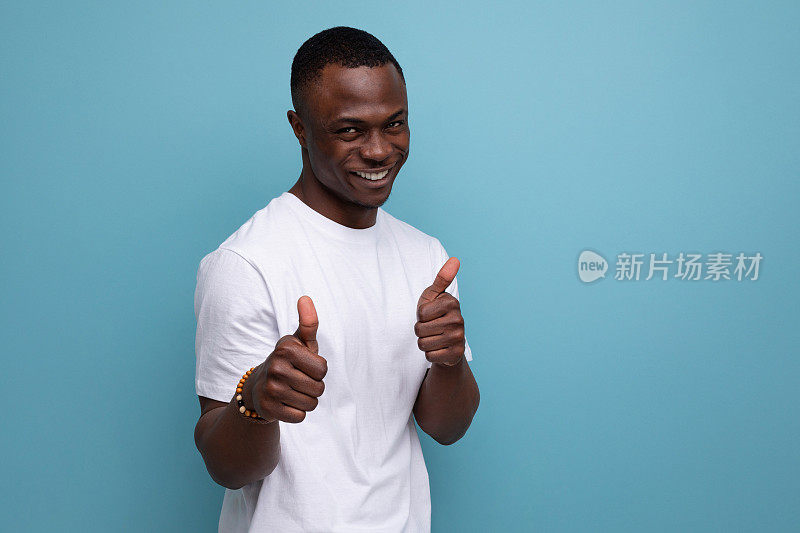 smiling 30 year old american male adult in white t-shirt showing class super gesture